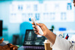 © DC Studio - Medic measuring the temperature during checkup appointment at doctor office, using a digital thermometer tool to check for flu symptoms. Advanced healthcare services. Close up.