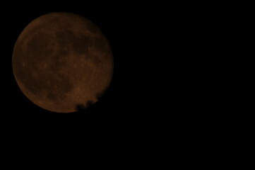 colorful moon against a clear sky