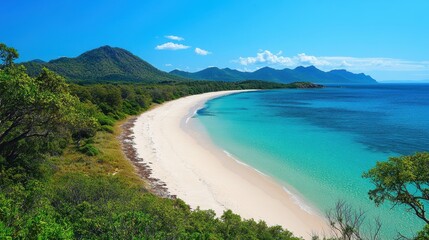 Wall Mural - Secluded beach with white sand and turquoise water, lush green mountains in background. Ideal for travel, tourism, and vacation brochures showcasing tropical destinations.