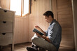 © kieferpix - man reading a book at home feeling relaxed