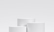 © Retouch man - White product display podium in studio room, for display presentation