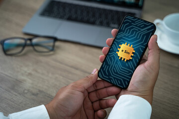 Poster - A person is holding a cell phone with a gold sticker on it that says 