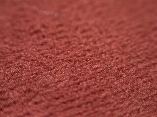 Aufkleber - The image is of a red carpet with a fuzzy texture