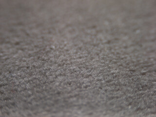 Fototapete - A close up of a carpet with a grainy texture