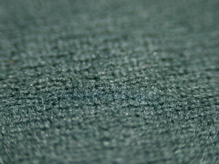 Poster - The image is of a carpet with a blue and green color