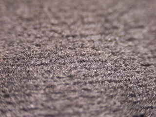 Poster - A close up of a carpet with a grainy texture