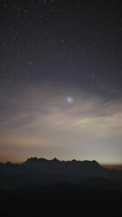 Wall Mural - night sky with moving stars above the northern landscape of chiang mai, thailand with the famous doi
