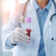 © Nidai - health check up medical early detection A healthcare professional holds a blood sample in a test tube, showcasing medical expertise and laboratory work.