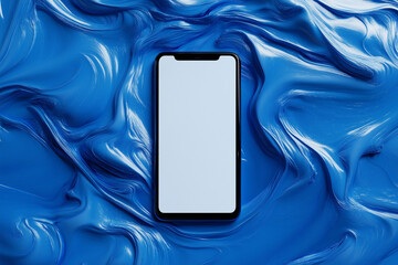 Poster - cell phone is sitting on a blue surface. The phone is turned off and has a white background. The blue surface is textured and he is made of paint or some other type of material