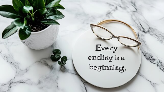 A minimalist desktop showing an inspirational quote Every ending is a new beginning.