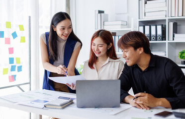 Wall Mural - Brainstorming Collaboration and  successful partnership analysis by Team of Young business Asian people working in an office workspace