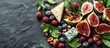 © cusniatul - Figs, cheese, berries slate board