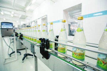 Poster - bottled beverage production in a modern factory setting with a focus on conveyor line operations