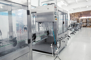 Poster - advanced bottling machine operates in a modern beverage manufacturing facility during daylight hours