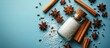 © Nijat - Sea salt bottle centered on a blue background surrounded by star anise and cinnamon sticks creating a warm and inviting composition
