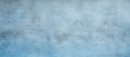 Wall Mural - Light blue textured stucco wall with a rough plaster surface and soft gradients, featuring a subtle copy space for design elements.