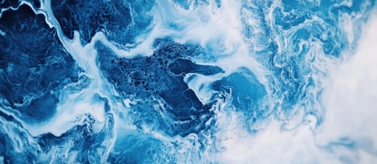 Poster - Close up of blue marble texture featuring intricate swirling patterns and varying shades of blue and white creating a dynamic visual effect
