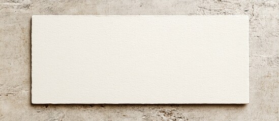 Wall Mural - Blank index card mockup on textured gray surface featuring a minimalistic design, soft white background, ideal for showcasing artwork and creativity.