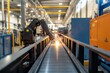© Box Milk - Robotic arms welding metal frames for modular homes. The production line is organized with equipment