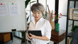 © Wanda - Senior business asian woman mature working in office