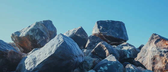 Aufkleber - Exploring the textures and sizes of large boulders against a clear blue sky