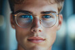 © Di Studio - close up portrait of handsome young man in glasses