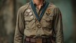 © Ali - Person wearing olive shirt, many medals, and belt.
