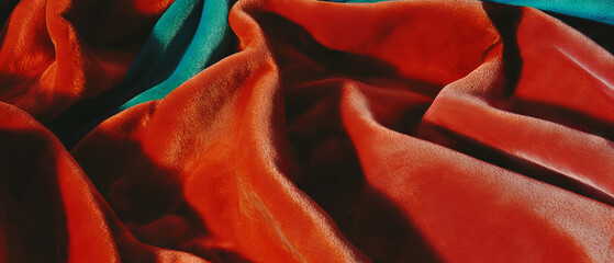 Poster - Rich red silk velvet drapes with soft texture and vibrant color variations