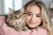 © Oksana_Latysheva - Beautiful young woman holding cute cat portrait