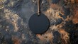 © -Quantum Pixels- - Blank black round sale tag positioned overhead on a textured dark bronze stone background with natural tones and rustic appeal.