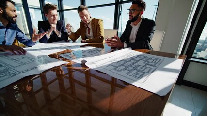 Poster - Architects collaborate on building plans in a modern office with city views during daylight