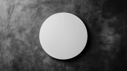 Leinwandbilder - Minimalist top view of a round white plate on a textured dark gray surface highlighting simplicity and elegance in modern dining settings