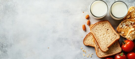 Poster - Healthy Breakfast Spread with Toasted Sandwiches, Fresh Tomatoes, Almonds, and Glasses of Milk on a Gray Marble Surface with Empty Space for Text