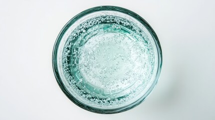 Poster - Aerial view of a clear glass filled with sparkling mineral water on a pristine white background showcasing freshness and purity Ñ‚ÐµÐ¼Ñ‹