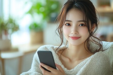 Aufkleber - A woman sits comfortably on a couch, engaged with her cell phone