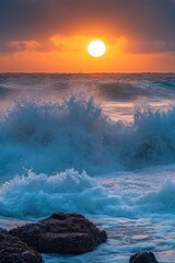 Wall Mural - Sunset over the ocean with waves crashing against the shore