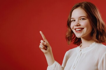 Poster - A woman in a white shirt pointing at something with her finger, likely drawing attention to it
