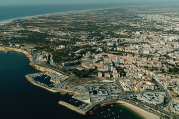 Wall Mural - Aerial view of a city's skyline overlooking a body of water, suitable for use in real estate or travel marketing materials