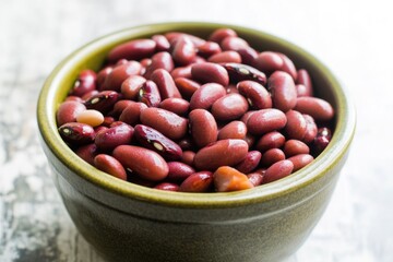 Aufkleber - A bowl filled with red beans sits on a table, perfect for use in food or lifestyle photography