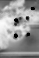 Wall Mural - a dreamy view of christmas tree lights in black and white film negative