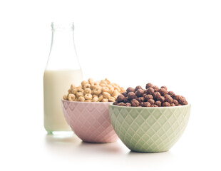 Canvas Print - Breakfast cereal rings and chocolate balls in bowls isolated on white background.