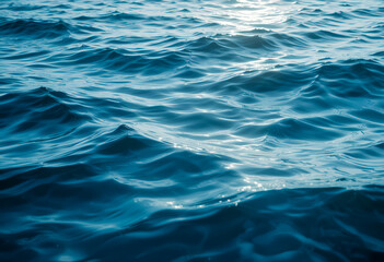 deep blue water surface with sunlight reflections, tranquil ocean waves, serene aquatic texture, close-up water photography