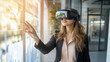 © bephoto - 室内オフィスでVRゴーグルを装着してプレゼンを行う日本人女性