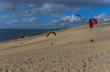 People paragliding at the Dune of Pilat