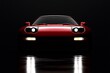 Sleek Red Sports Car Illuminates a Dark Garage