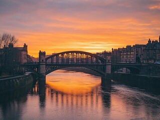 Poster - Golden sunset over river, reflecting on bridge and cityscape.