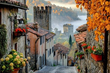 Poster - Misty autumn morning in a picturesque medieval village with stone houses, cobblestone streets, and colorful flowers.