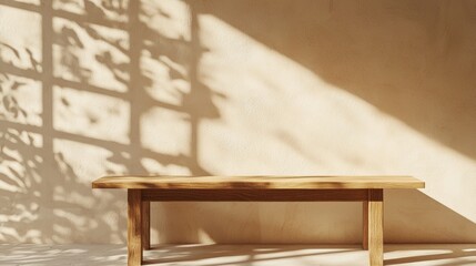 Poster - A rustic wooden table sits against a stucco wall, illuminated by warm afternoon light. Shadows dance across the surface, enhancing the calming and inviting ambiance of the space