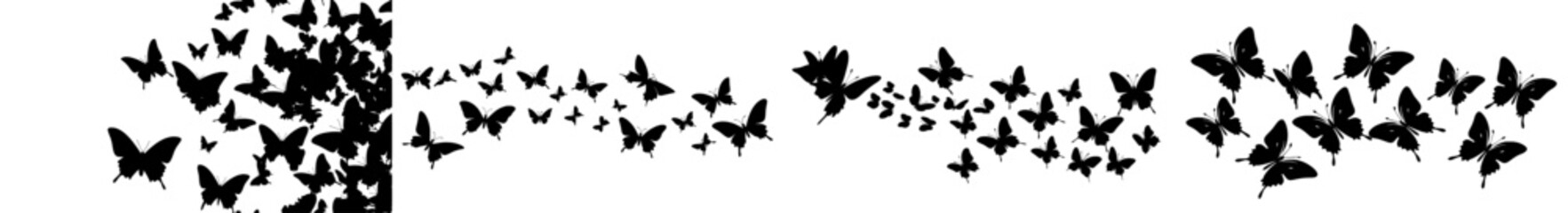 Wall Mural - A group of black butterflies in silhouette, flying against a white backdrop. Modern artwork