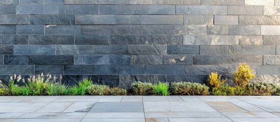 Poster - Modern urban slate wall with textured finish and concrete walkway perfect for contemporary landscaping and architectural design projects